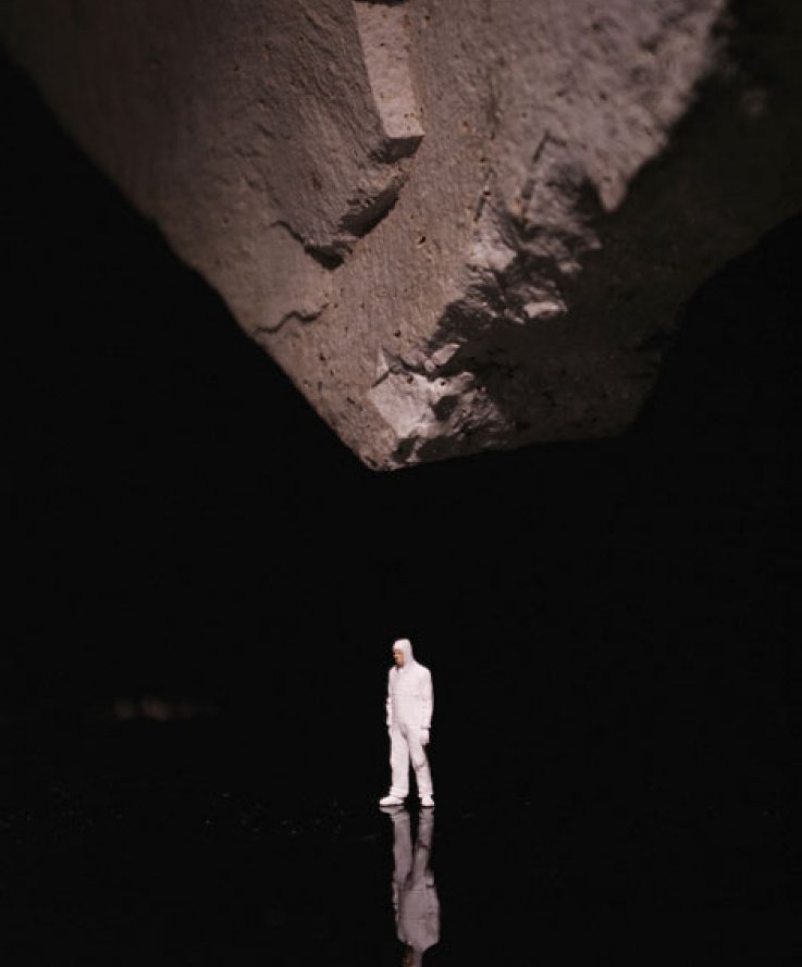 Nature Above, 2012, <br />
Black plexiglass, stone and miniature figure